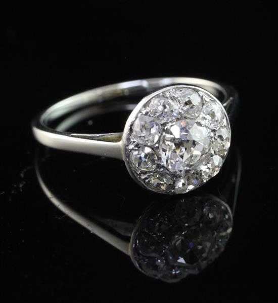 A platinum and old cut diamond cluster ring, size N.